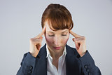 Stressed businesswoman getting a headache