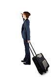 Businesswoman holding suitcase and looking