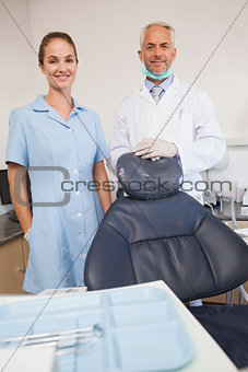 Dentist and assistant smiling at camera