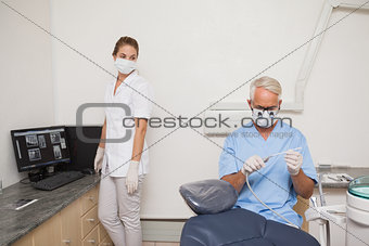 Dentist and assistant getting ready for patient