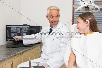 Dentist explaining xrays to little girl