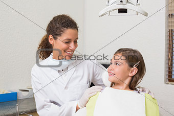 Little girl smiling with her pediatric dentist