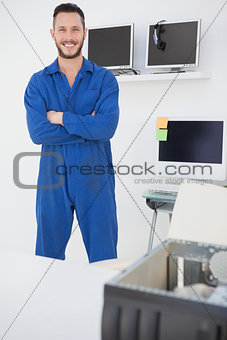 Computer engineer standing and smiling at camera