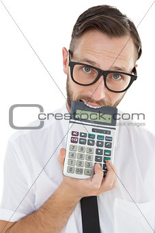 Nerdy excited businessman biting calculator