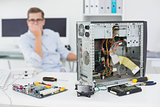 Computer engineer looking at broken console
