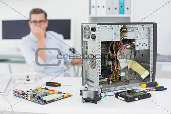 Computer engineer looking at broken console