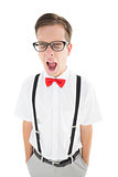 Nerdy hipster yawning in suspenders and bow tie