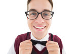 Nerdy hipster fixing his bow tie