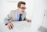 Excited businessman working on computer