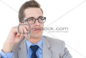 Nerdy businessman holding pen looking away