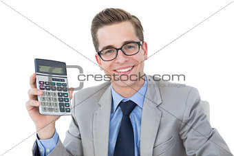 Nerdy businessman showing his calculator