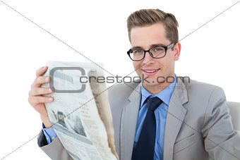 Nerdy businessman reading the newspaper