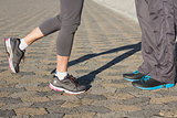 Couple in running shoes facing each other