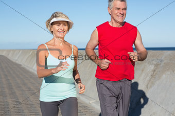 Active senior couple out for a jog