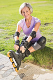 Active senior woman ready to go rollerblading