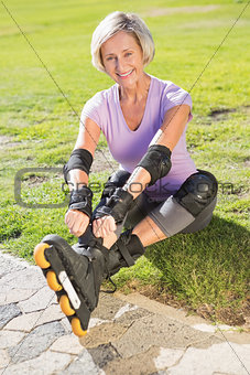 Active senior woman ready to go rollerblading