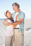 Happy senior couple embracing on the pier