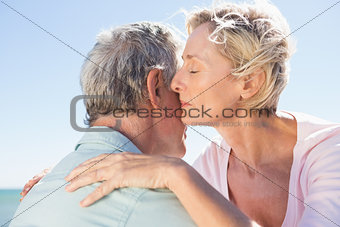 Senior woman hugging her partner