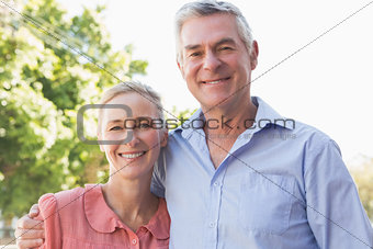 Senior couple smiling at the camera together