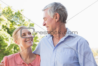 Senior couple smiling at each other