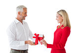 Smiling couple holding a gift