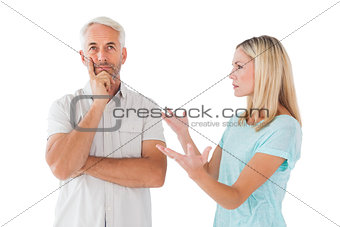 Unhappy couple having an argument with man not listening