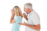 Angry man shouting at his wife