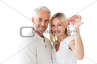Happy couple showing their new house key