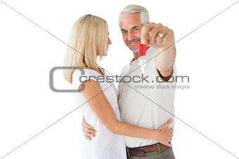 Happy couple showing their new house key