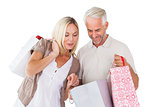 Happy couple holding shopping bags