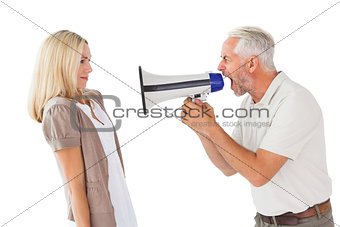 Angry man shouting at girlfriend through megaphone