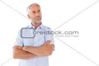 Thinking man posing with arms crossed