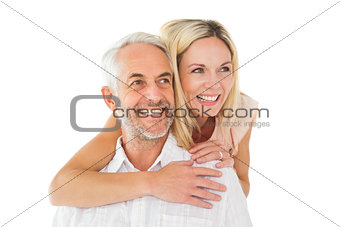 Happy man giving his partner a piggy back