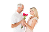 Affectionate man offering his partner roses