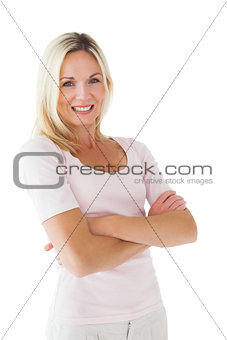 Happy blonde smiling with arms crossed