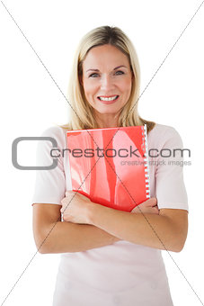 Happy mature student holding notebook