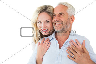 Smiling couple embracing with woman looking at camera