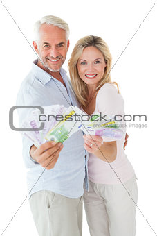 Happy couple flashing their cash