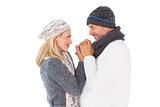 Couple in winter fashion embracing