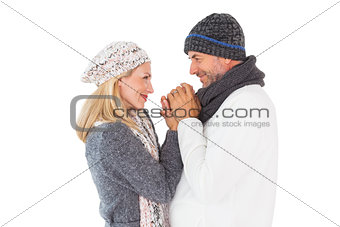 Couple in winter fashion embracing