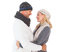 Happy couple in winter fashion embracing