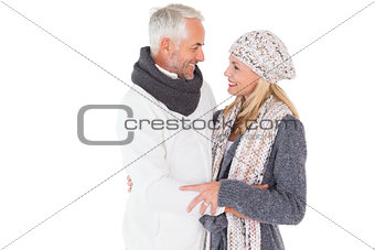Happy couple in winter fashion embracing