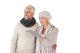 Happy couple in winter fashion looking