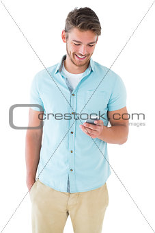 Handsome young man using his smartphone