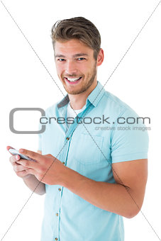 Handsome young man using his smartphone