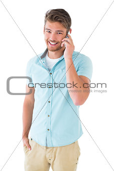 Handsome young man talking on his smartphone