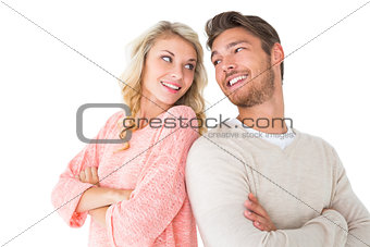Attractive couple smiling with arms crossed
