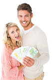 Attractive couple flashing their cash