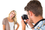 Man taking photo of his girlfriend sticking her tongue out