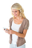 Attractive blonde using her smartphone
